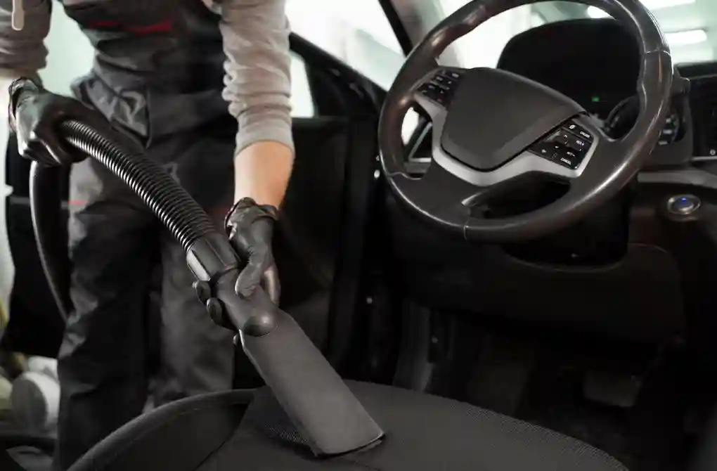 Interior Auto detailing with a vacuum cleaner